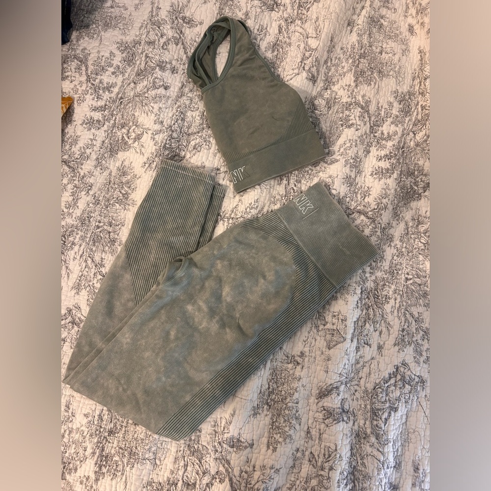 Pink seamless leggings and bra. Size S. Pink logo on bra is faded (pictured)